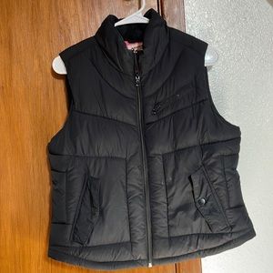 Large, black puffy vest. Fits more like a medium.